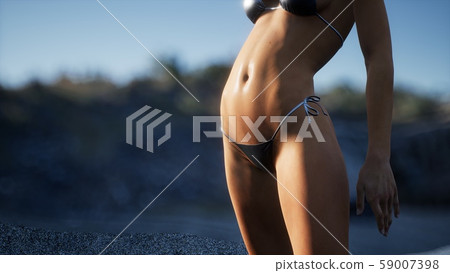 Beautiful Woman in Sexy Bikini near the Rocks Beautiful Woman in Sexy Bikini near the Rocks 59007398