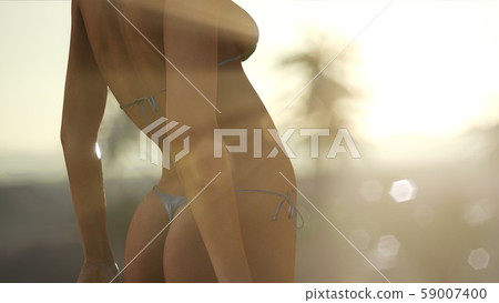 Young Woman in Swimsuit at Sunset Young Woman in Swimsuit at Sunset 59007400