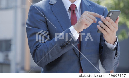 Businessman suit smartphone smartphone mobile phone 59008127