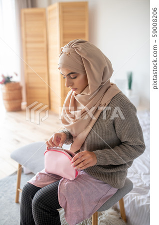 Stylish young girl getting ready to do makeup Stylish young girl getting ready to do makeup 59008206