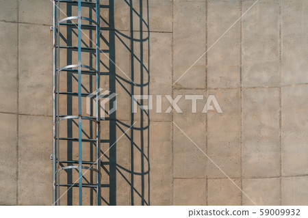 shadow of stairway on storage tank 59009932