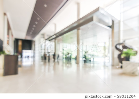 Blur hotel or office lobby background interior view toward reception hall, modern luxury white room space with blurry corridor and building glass wall window Blur hotel or office lobby background interior view toward reception hall, modern luxury white room space with blurry corridor and building glass wall window 59011204