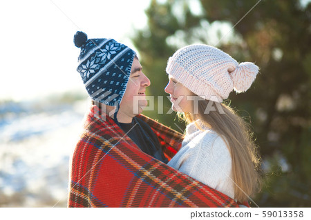 Winter walk through the woods. The guy with the Winter walk through the woods. The guy with the 59013358
