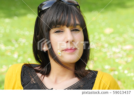 young smiling brunette girl, outdoors 59013437