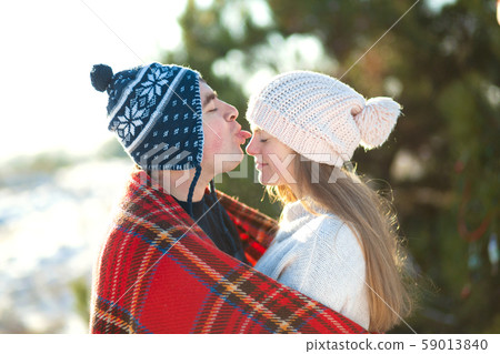 Winter walk through the woods. The guy with the Winter walk through the woods. The guy with the 59013840