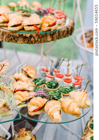Catering buffet and rustic decor, outdoor wedding party with healthy food snacks 59014655