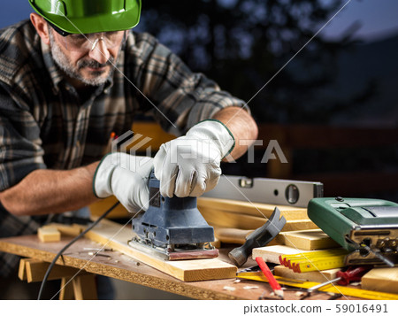 Craftsman at work on wooden boards. Carpentry. Craftsman at work on wooden boards. Carpentry. 59016491