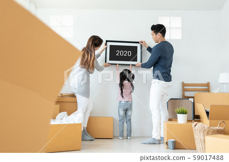 Happy Asian family picture holding frame during 59017488