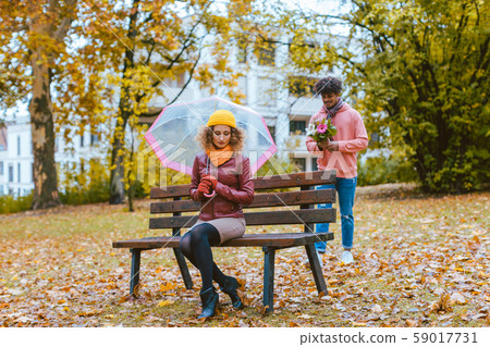 Man having to apologize to his wife or girlfriend Man having to apologize to his wife or girlfriend 59017731