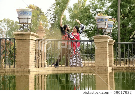 Man And Woman Dancing Flamenco In Traditional Clothes Man And Woman Dancing Flamenco In Traditional Clothes 59017922
