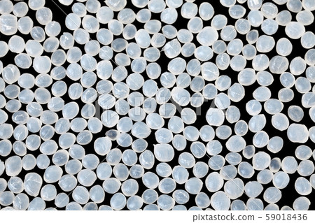 Close up picture of polyamide granules on black Close up picture of polyamide granules on black 59018436