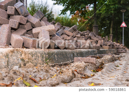 Road repair. Paving slabs. Building material for the road. Road repair. Paving slabs. Building material for the road. 59018861