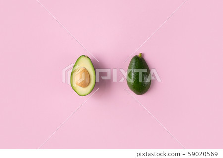 Avocado halves isolated on pink top view 59020569
