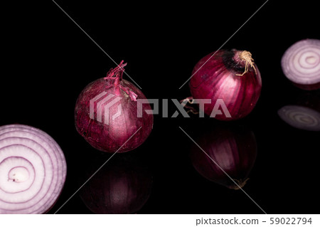 Fresh red onion isolated on black glass Fresh red onion isolated on black glass 59022794