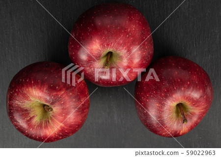 Red delicious apple on grey stone Red delicious apple on grey stone 59022963