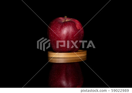 Red delicious apple isolated on black glass Red delicious apple isolated on black glass 59022989