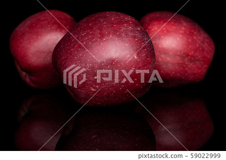 Red delicious apple isolated on black glass Red delicious apple isolated on black glass 59022999