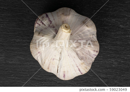 White aromatic garlic on grey stone 59023049