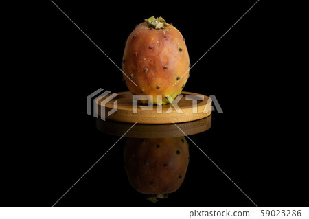 Fresh orange opuntia isolated on black glass 59023286