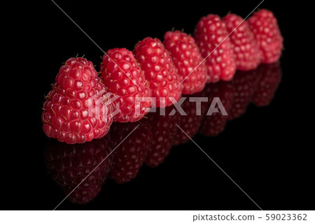 Fresh red raspberry isolated on black glass Fresh red raspberry isolated on black glass 59023362