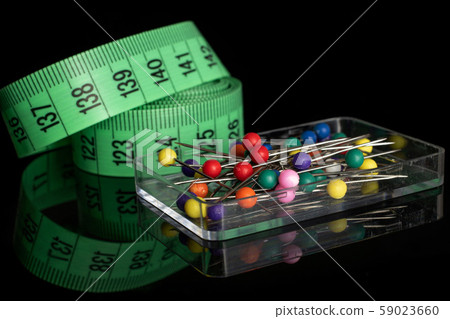 Haberdashery item isolated on black glass 59023660