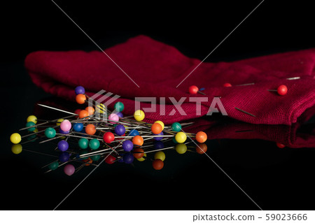 Haberdashery item isolated on black glass 59023666