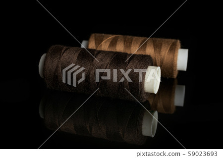 Haberdashery item isolated on black glass 59023693