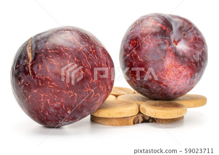 Fresh red plum isolated on white 59023711