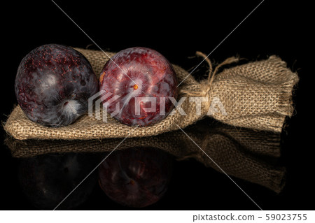 Fresh red plum isolated on black glass Fresh red plum isolated on black glass 59023755