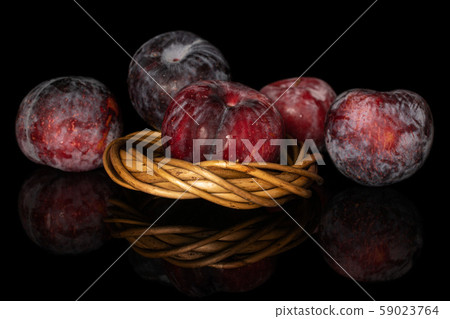 Fresh red plum isolated on black glass Fresh red plum isolated on black glass 59023764