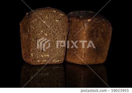 Fresh baked dark bread isolated on black glass 59023955