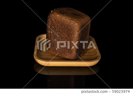 Fresh baked dark bread isolated on black glass 59023974