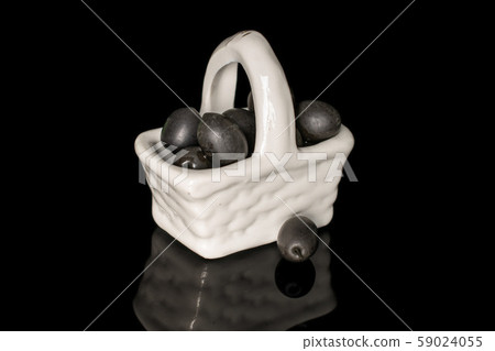 Black canned olive isolated on black glass 59024055