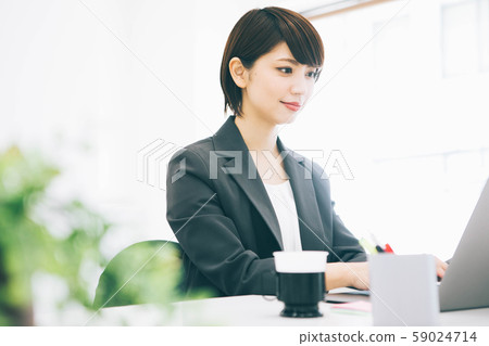 A woman working in a bright office A woman working in a bright office 59024714
