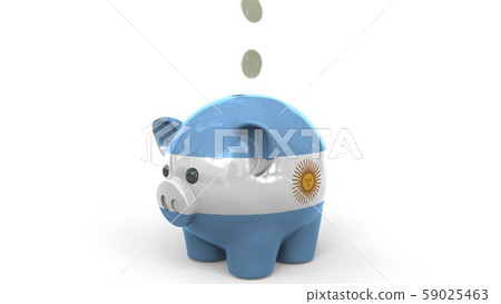 Coins fall into piggy bank painted with flag of Argentina. National banking system or savings 59025463