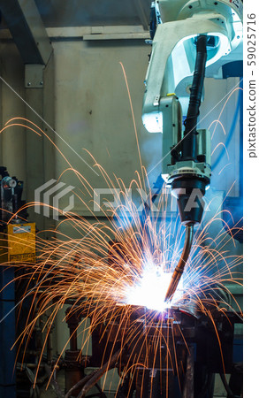 Robots welding in a car factory Robots welding in a car factory 59025716