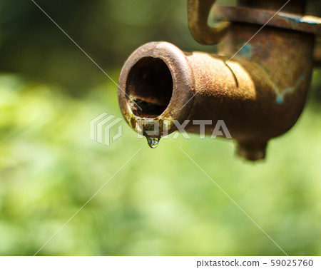 Artesian pump water droplets Old. Artesian pump water droplets Old. 59025760
