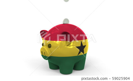 Coins fall into piggy bank painted with flag of Ghana. National banking system or savings related Coins fall into piggy bank painted with flag of Ghana. National banking system or savings related 59025904