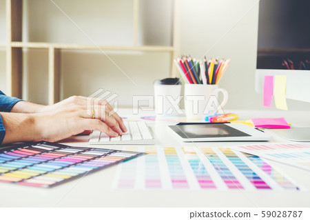Graphic designer drawing on graphics tablet at Graphic designer drawing on graphics tablet at 59028787