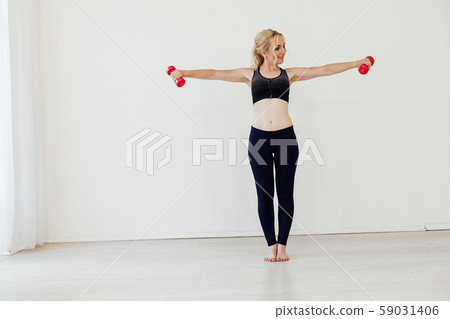 Blonde woman sports fitness with dumbbells body Blonde woman sports fitness with dumbbells body 59031406