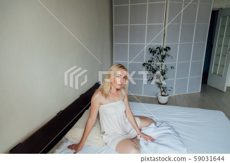 woman woke up in the morning in the sleep on the bed woman woke up in the morning in the sleep on the bed 59031644