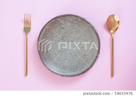Empty plate, Table setting. Ceramic plate, spoon Empty plate, Table setting. Ceramic plate, spoon 59033476