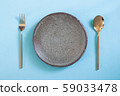 Empty plate, Table setting. Ceramic plate, spoon 59033478