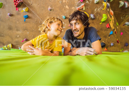 Dad and son at the climbing wall. Family sport, healthy lifestyle, happy family 59034135