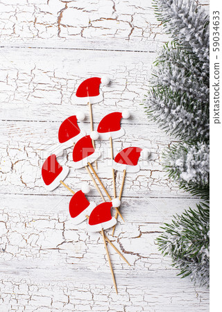 Christmas background with decorative Santa hats 59034633