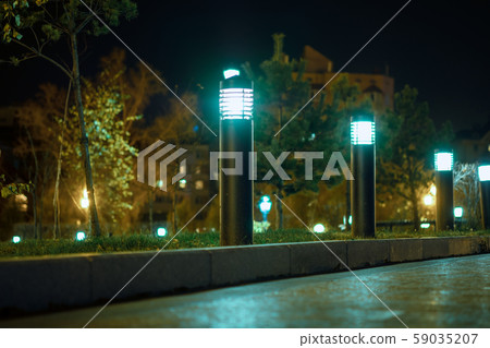 Komsomolskaya square of Khabarovsk at night by the light of lanterns. 59035207