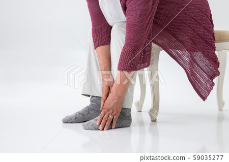 Elderly woman with ankle pain Elderly woman with ankle pain 59035277