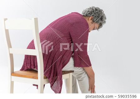 Back view of an elderly person who has a pain in his leg Back view of an elderly person who has a pain in his leg 59035596