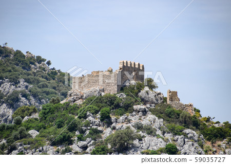ruins of an ancient fortress on top of a cliff. ruins of an ancient fortress on top of a cliff. 59035727