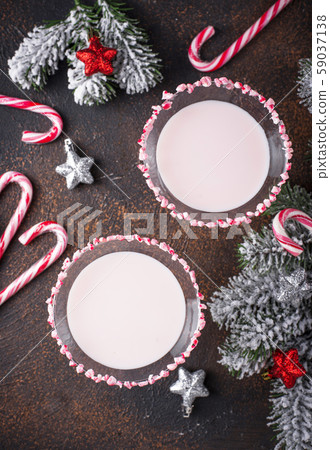 Pink peppermint martini with candy cane rim 59037138